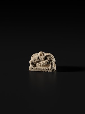 Lot 44 - A WHITE LIMESTONE AMULET OF SOBEK, PTOLEMAIC PERIOD