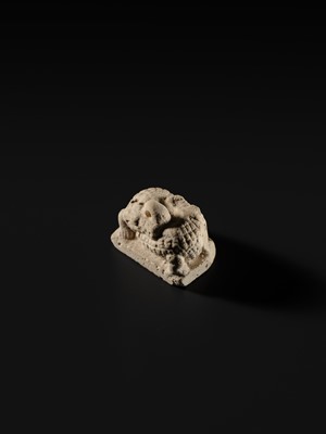 Lot 44 - A WHITE LIMESTONE AMULET OF SOBEK, PTOLEMAIC PERIOD