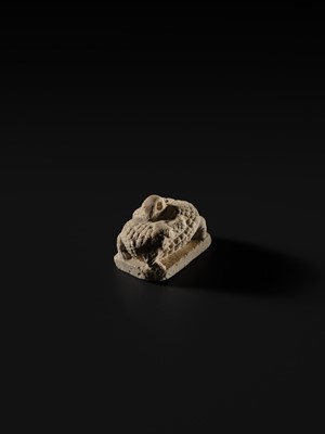 Lot 44 - A WHITE LIMESTONE AMULET OF SOBEK, PTOLEMAIC PERIOD