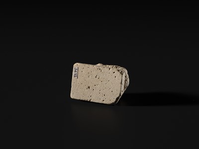 Lot 44 - A WHITE LIMESTONE AMULET OF SOBEK, PTOLEMAIC PERIOD