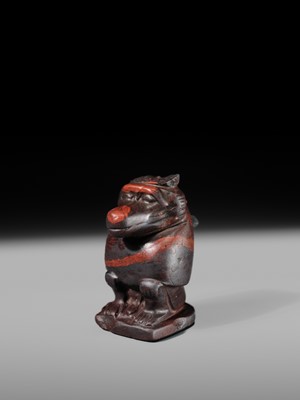 Lot 41 - AN EXCEPTIONAL RED JASPER AMULET OF A BABOON, LATE TO PTOLEMAIC PERIOD