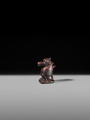 Lot 41 - AN EXCEPTIONAL RED JASPER AMULET OF A BABOON, LATE TO PTOLEMAIC PERIOD