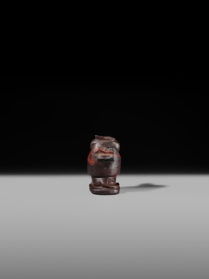 Lot 41 - AN EXCEPTIONAL RED JASPER AMULET OF A BABOON, LATE TO PTOLEMAIC PERIOD