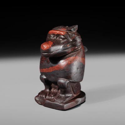 Lot 41 - AN EXCEPTIONAL RED JASPER AMULET OF A BABOON, LATE TO PTOLEMAIC PERIOD