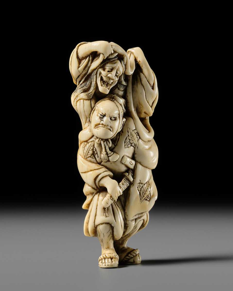 Lot 107 - A GOOD IVORY NETSUKE OF OMORI HIKOSHICHI ENCOUNTERING THE DEMONESS