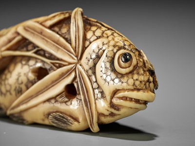 Lot 372 - KOSEN: A FINE IVORY NETSUKE OF TWO FISH AND BAMBOO