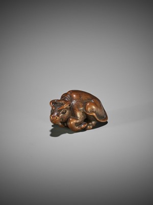 KOKEI: A WOOD NETSUKE OF A RECUMBENT OX