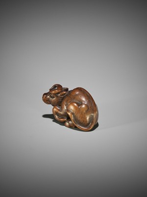 KOKEI: A WOOD NETSUKE OF A RECUMBENT OX