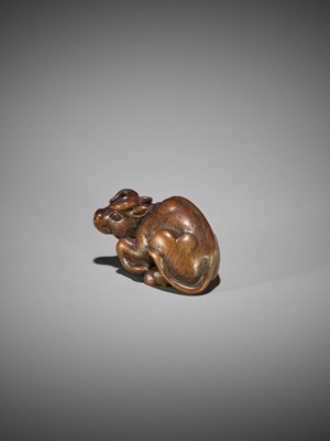KOKEI: A WOOD NETSUKE OF A RECUMBENT OX