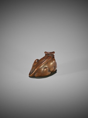 KOKEI: A WOOD NETSUKE OF A RECUMBENT OX