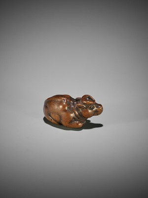 KOKEI: A WOOD NETSUKE OF A RECUMBENT OX