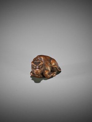 KOKEI: A WOOD NETSUKE OF A RECUMBENT OX
