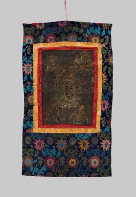Lot 45 - A BLACK-GROUND THANGKA DEPICTING RAHULA, TIBET, 18TH TO EARLY 19TH CENTURY