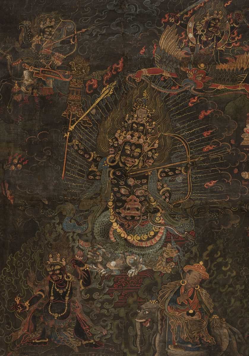 Lot 45 - A BLACK-GROUND THANGKA DEPICTING RAHULA, TIBET, 18TH TO EARLY 19TH CENTURY