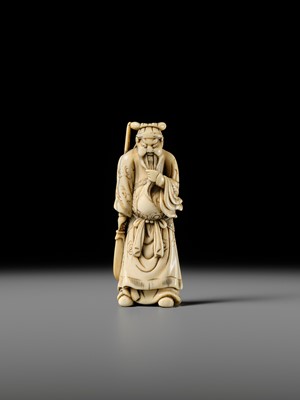 Lot 106 - A LARGE AND SUPERB IVORY NETSUKE OF KAN’U