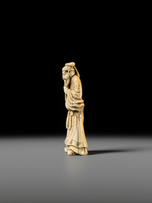Lot 106 - A LARGE AND SUPERB IVORY NETSUKE OF KAN’U