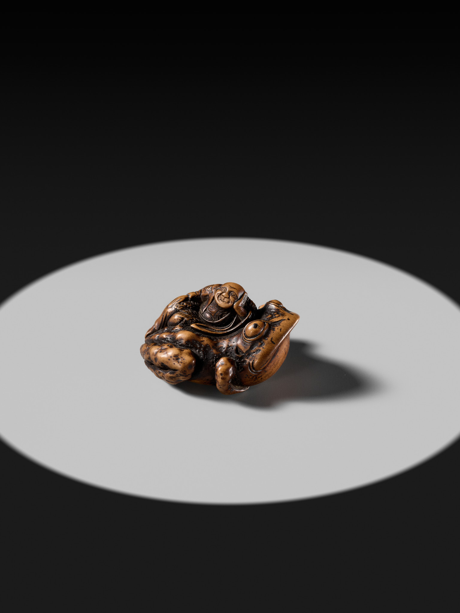 Lot 234 - YASUSADA SHUZAN: A WOOD NETSUKE OF GAMA