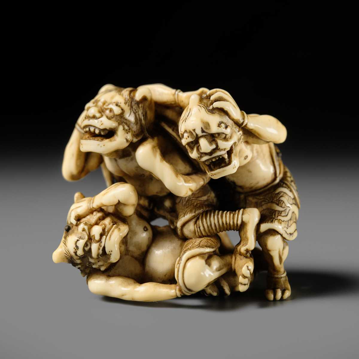 Lot 271 - GYOKKOSAI: A SUPERB IVORY NETSUKE OF THREE ONI AT SETSUBUN