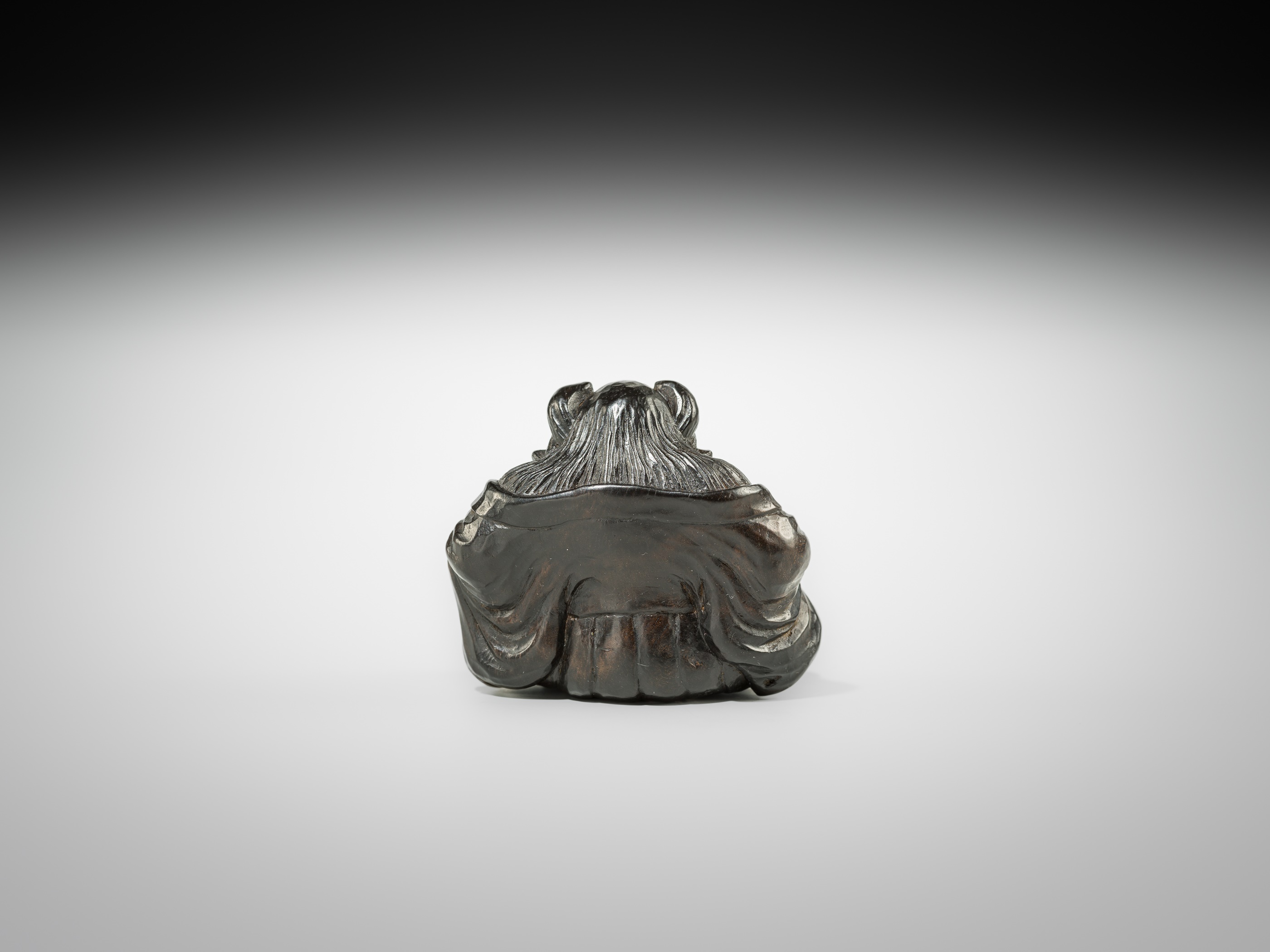 Lot 594 - SEISAI: A POWERFUL DARK WOOD NETSUKE OF ONI