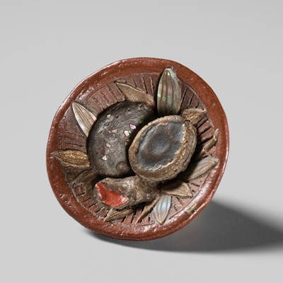Lot 494 - NOMURA CHOHEI: A RARE LACQUERED AND INLAID CERAMIC NETSUKE OF A MORTAR WITH SHELLS