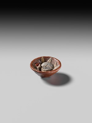 Lot 494 - NOMURA CHOHEI: A RARE LACQUERED AND INLAID CERAMIC NETSUKE OF A MORTAR WITH SHELLS