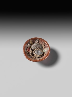 Lot 494 - NOMURA CHOHEI: A RARE LACQUERED AND INLAID CERAMIC NETSUKE OF A MORTAR WITH SHELLS