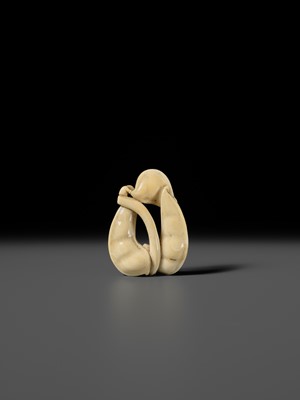 Lot 136 - AN IVORY NETSUKE OF EDAMAME BEAN PODS