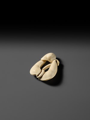 Lot 136 - AN IVORY NETSUKE OF EDAMAME BEAN PODS