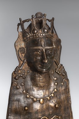 Lot 1258 - A BRONZE PAHARI STYLE MOHRA OF SHIVA, HIMACHAL PRADESH, 19TH CENTURY OR EARLIER