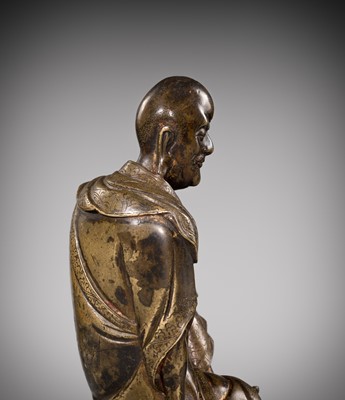 Lot 55 - A RARE BRONZE FIGURE OF A LUOHAN, YUAN-MING DYNASTY