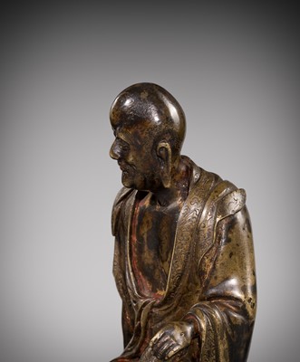 Lot 55 - A RARE BRONZE FIGURE OF A LUOHAN, YUAN-MING DYNASTY