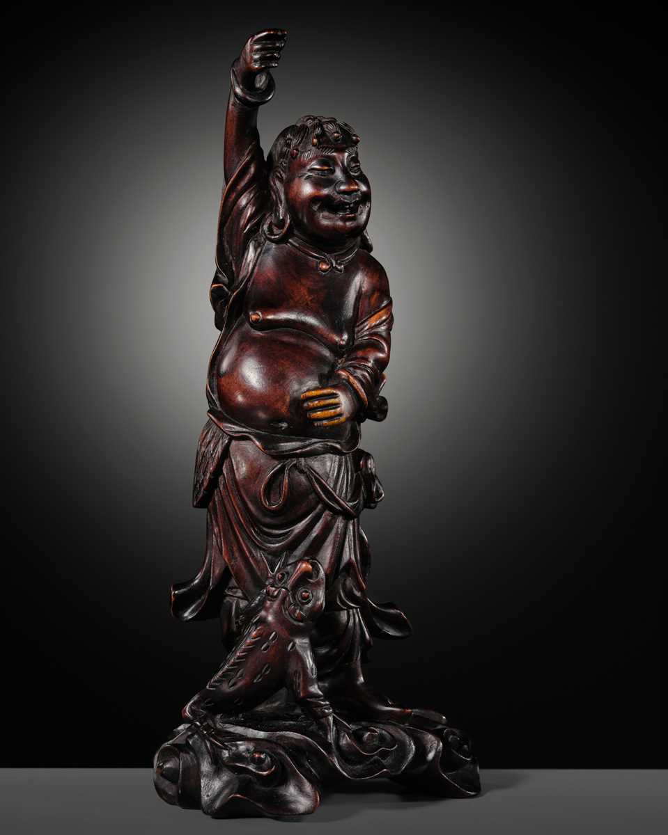 A CARVED WOOD FIGURE OF LIU HAI AND HIS THREE-LEGGED TOAD, LATE QING DYNASTY TO REPUBLIC PERIOD