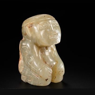 Lot 114 - AN EXTREMELY RARE CELADON AND RUSSET JADE ‘KNEELING FIGURE’, SHANG DYNASTY