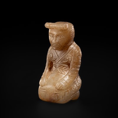 AN EXCEEDINGLY RARE ‘FU HAO TYPE’ WHITE AND RUSSET JADE CARVING OF A KNEELING HUMAN FIGURE, SHANG DYNASTY