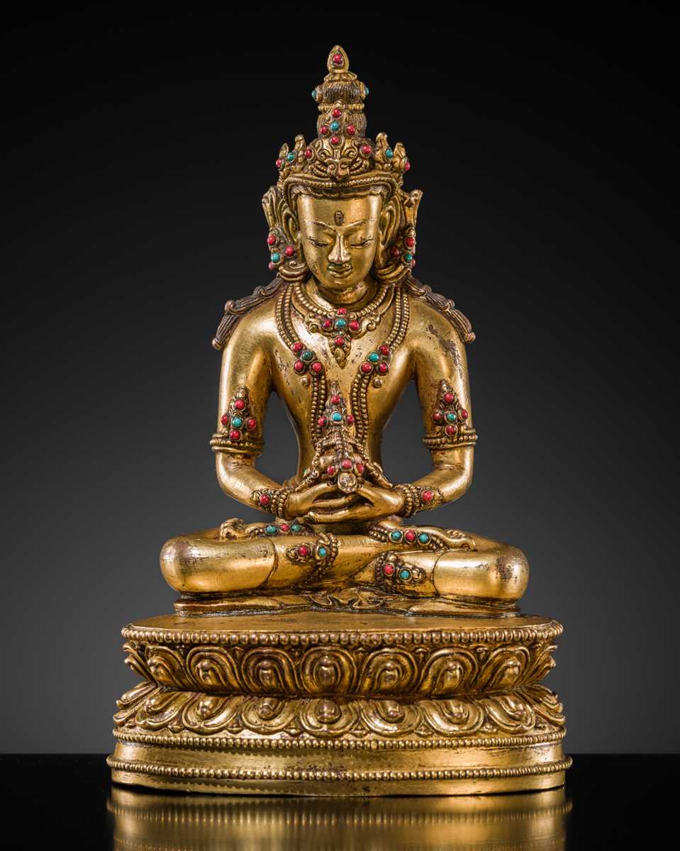 Lot 26 - AN INLAID GILT-BRONZE FIGURE OF AMITAYUS, TIBET, 19TH TO EARLY 20TH CENTURY