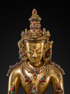 Lot 26 - AN INLAID GILT-BRONZE FIGURE OF AMITAYUS, TIBET, 19TH TO EARLY 20TH CENTURY