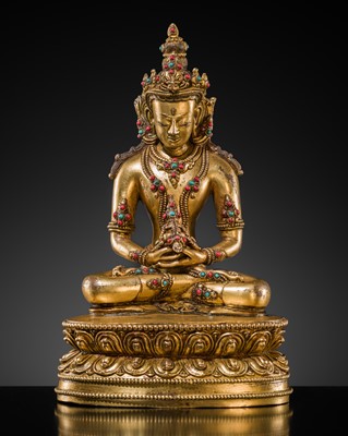 Lot 26 - AN INLAID GILT-BRONZE FIGURE OF AMITAYUS, TIBET, 19TH TO EARLY 20TH CENTURY