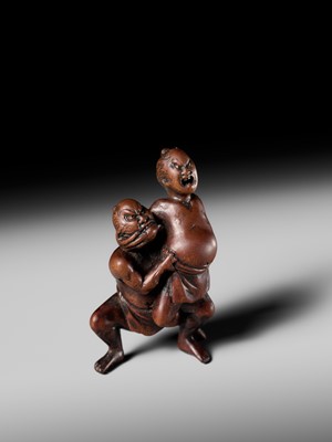 Lot 194 - ITTAN: A WOOD NETSUKE OF TWO SUMO WRESTLERS