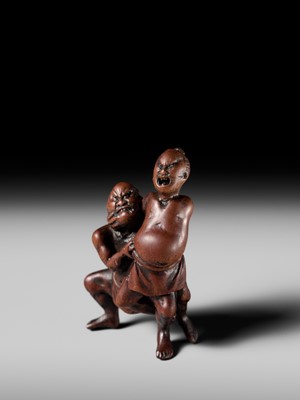 Lot 194 - ITTAN: A WOOD NETSUKE OF TWO SUMO WRESTLERS
