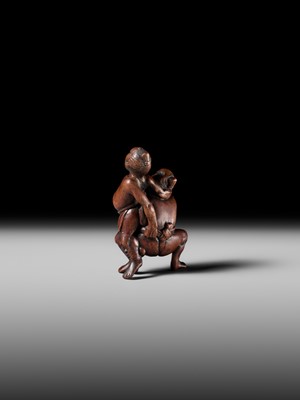 Lot 194 - ITTAN: A WOOD NETSUKE OF TWO SUMO WRESTLERS