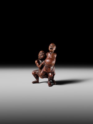 Lot 194 - ITTAN: A WOOD NETSUKE OF TWO SUMO WRESTLERS