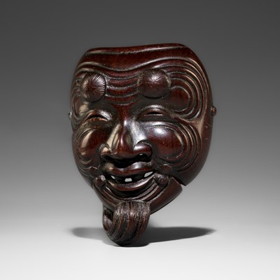 HOZAN: A WOOD MASK NETSUKE OF OKINA