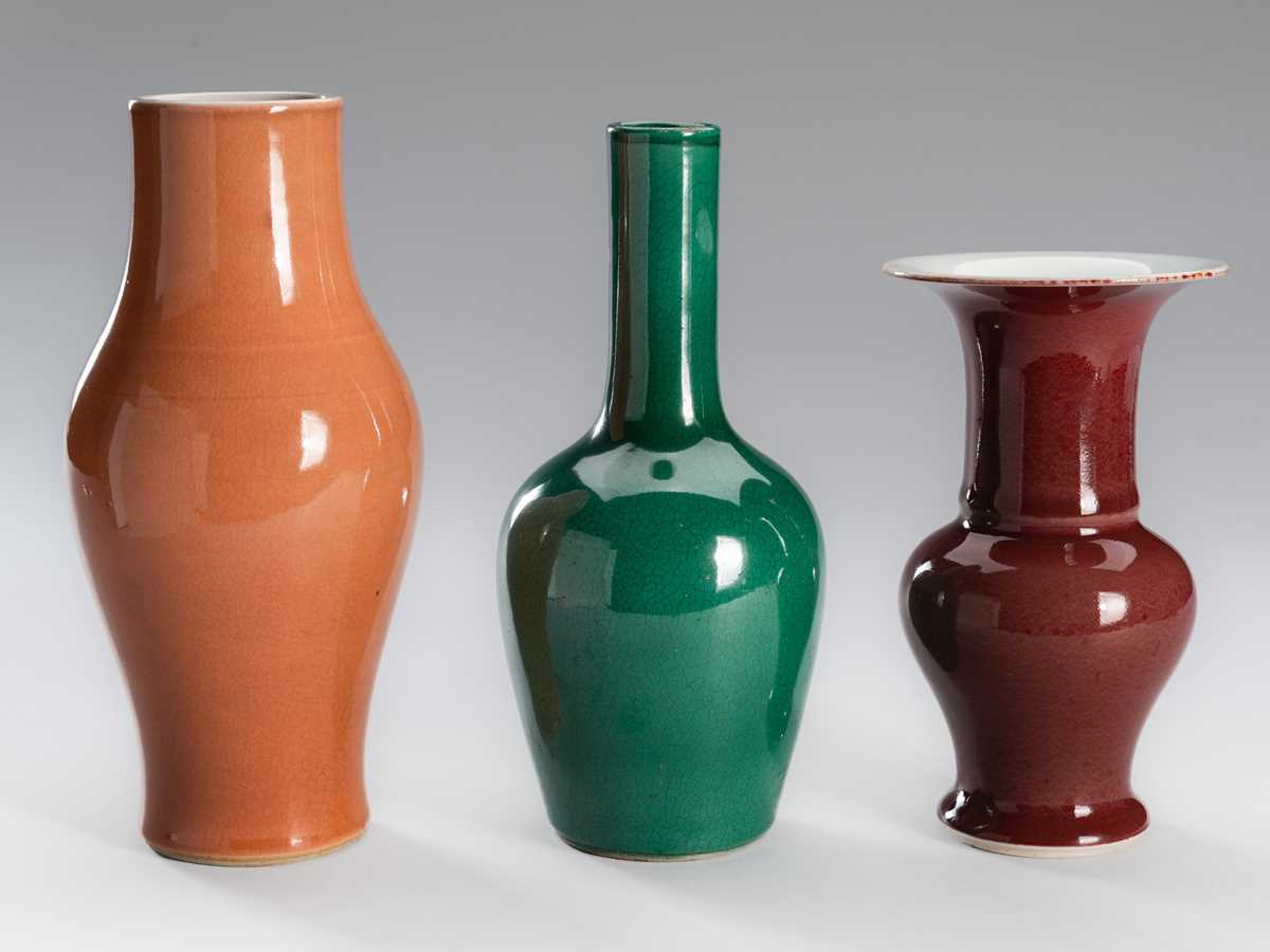 Lot 1200 - A GROUP OF THREE MONOCHROME GLAZED PORCELAIN VASES, LATE QING DYNASTY TO REPUBLIC PERIOD