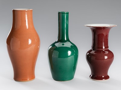 Lot 1200 - A GROUP OF THREE MONOCHROME GLAZED PORCELAIN VASES, LATE QING DYNASTY TO REPUBLIC PERIOD