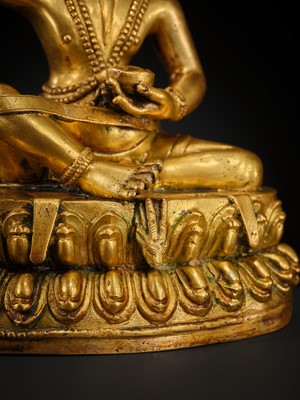 A GILT BRONZE FIGURE OF THE MAHASIDDHA VIRUPA, 18TH – 19TH CENTURY