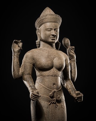 Lot 260 - AN IMPORTANT SANDSTONE FIGURE OF LAKSHMI, ANGKOR PERIOD