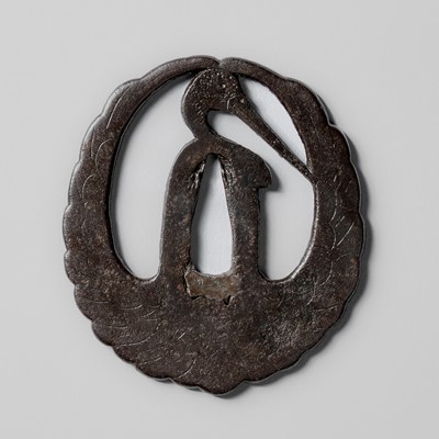 Lot 1827 - AN IRON HIGO SUKASHI TSUBA WITH A CRANE