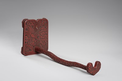Lot 519 - A FINE TSUISHU (CARVED RED LACQUER) TACHI-KAKE (SWORD STAND)