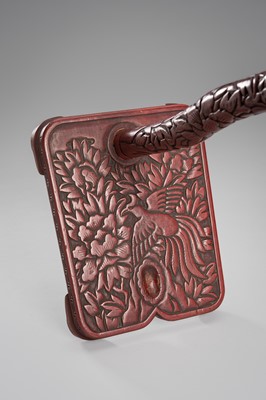 Lot 519 - A FINE TSUISHU (CARVED RED LACQUER) TACHI-KAKE (SWORD STAND)