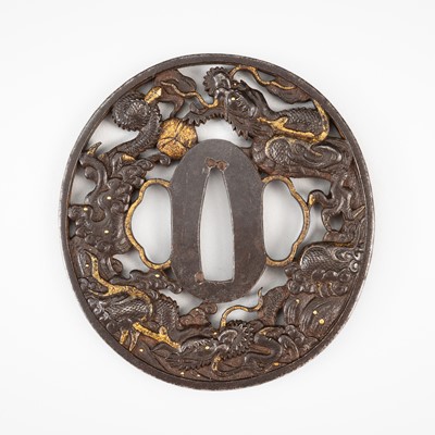 Lot 553 - A FINE IRON SUKASHI TSUBA WITH DRAGONS